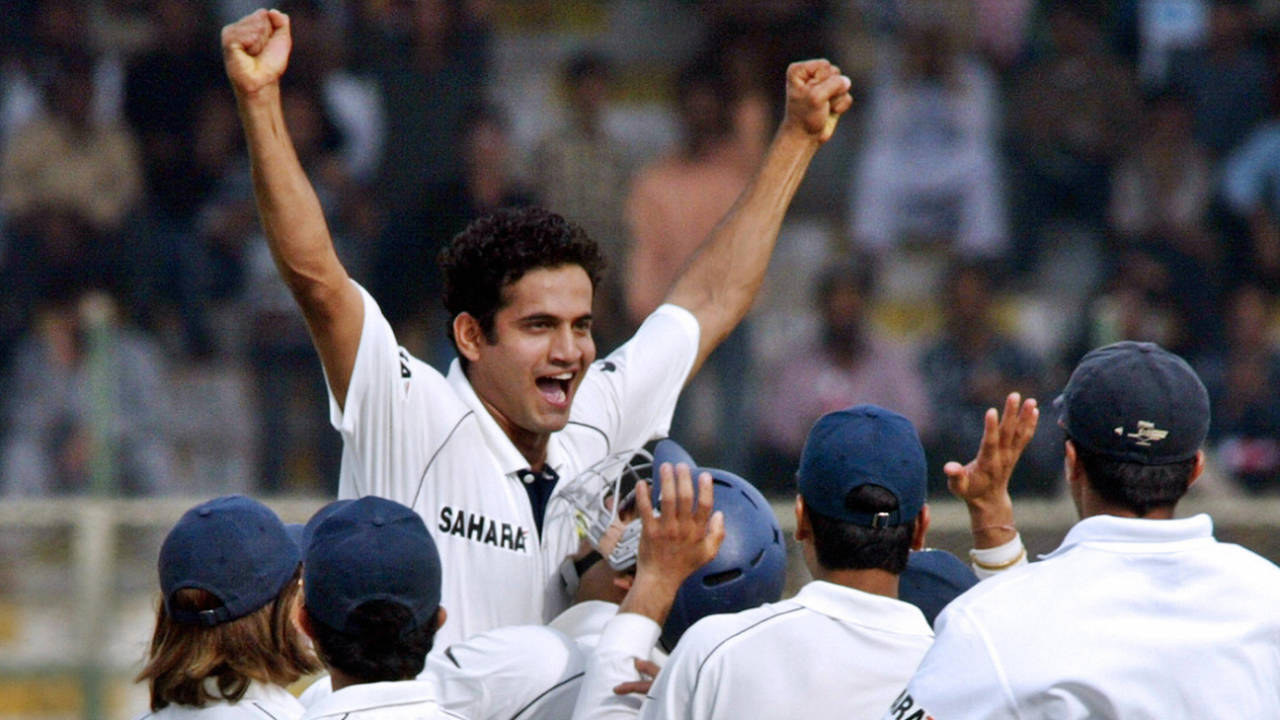 Irfan Pathan is mobbed by his team-mates after taking a hat-trick in the first over of the 2006 Karachi Test