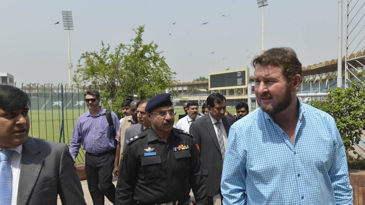 Alistair Campbell talks to reporters after reviewing the security arrangements at the Gaddafi Stadium