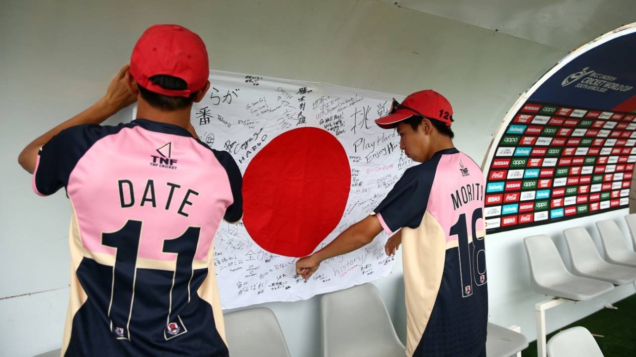 Neel Date and Masato Morita hang up a national flag with personal messages in the dugout, India v Japan, Under-19 World Cup 2020, Bloemfontein, January 21, 2020