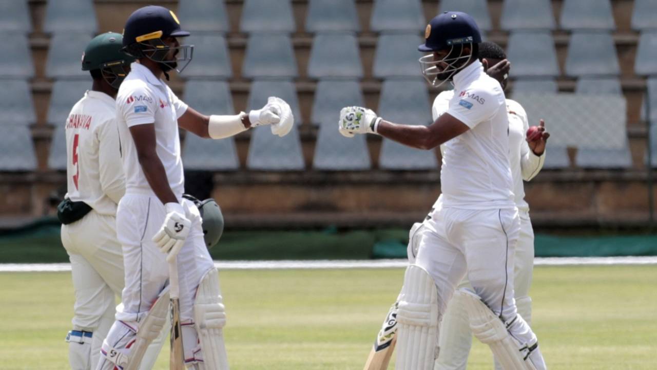 Dimuth Karunaratne and Oshada Fernando punch gloves during their partnership, Zimbabwe v Sri Lanka, 2nd Test, Harare, 2nd day, January 28, 2020