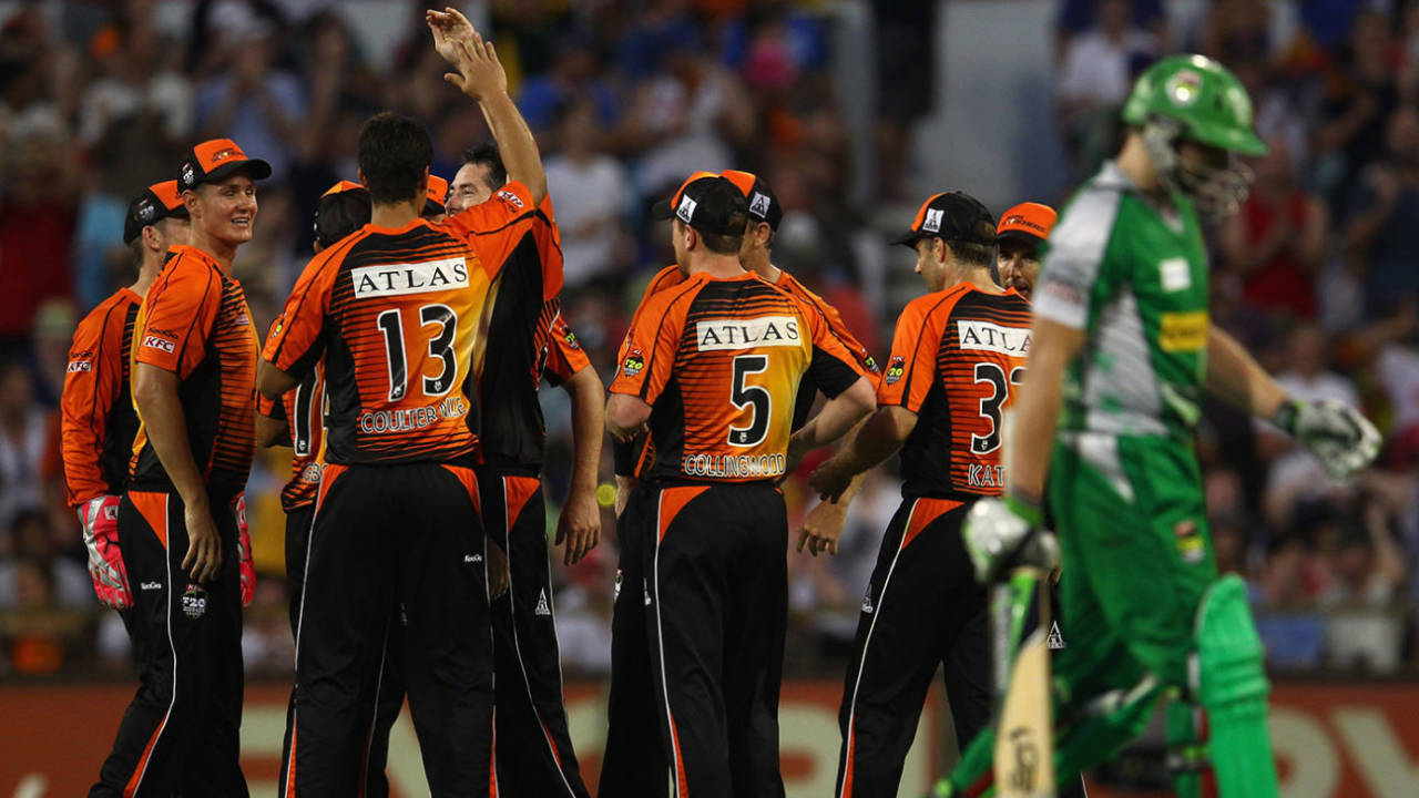 Luke Wright walks off as Perth Scorchers celebrate during the 2011-12 final