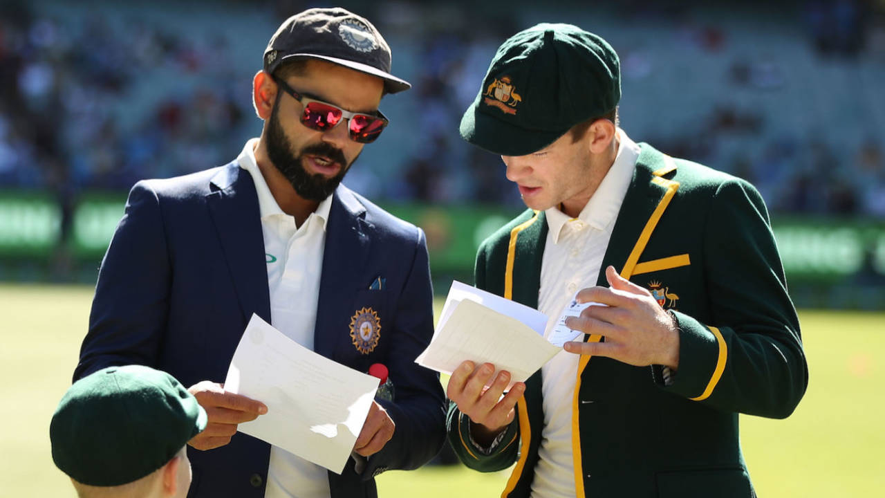 Virat Kohli and Tim Paine exchange team sheets before the coin toss&nbsp;&nbsp;&bull;&nbsp;&nbsp;Getty Images