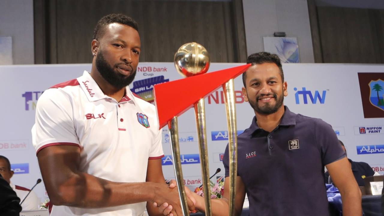 Kieron Pollard and Dimuth Karunaratne pose with the series trophy, Colombo, February 20, 2020