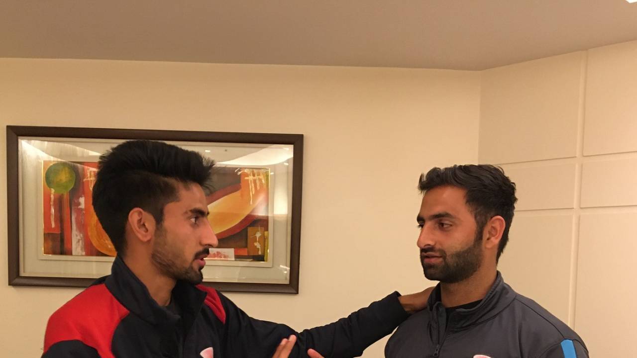 Mujtaba Yousuf (L) and Aquib Nabi compare bowling grips, Jammu, February 22, 2020