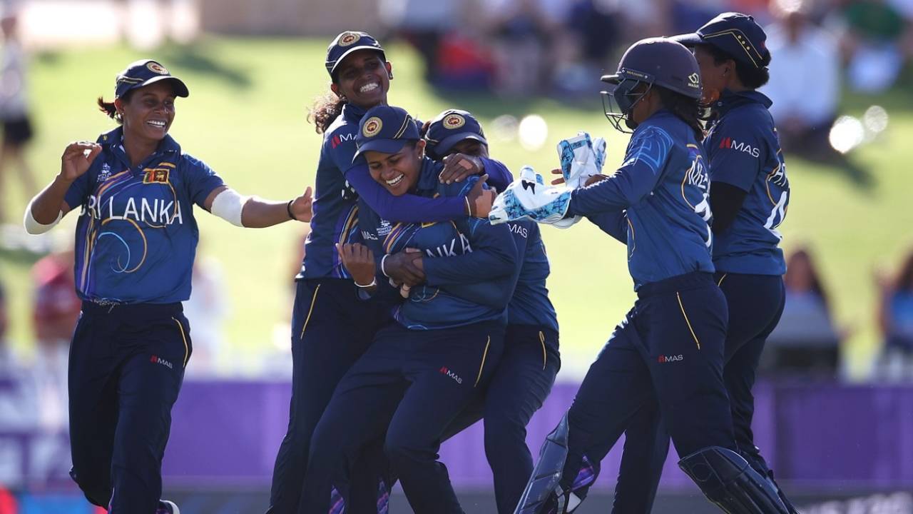 Shashikala Siriwardene is mobbed by her team-mates after picking up a wicket