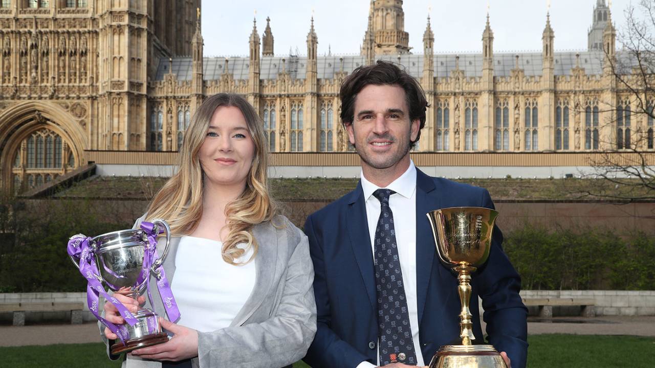 Lauren Griffiths and Ryan ten Doeschate with the Women's One Day Cup and County Championship trophies