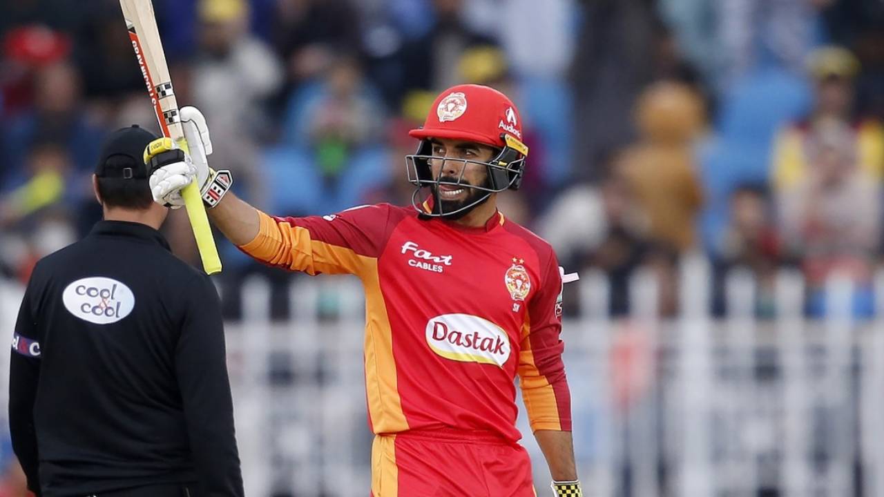 Shadab Khan raises his bat after getting to a fifty&nbsp;&nbsp;&bull;&nbsp;&nbsp;Associated Press