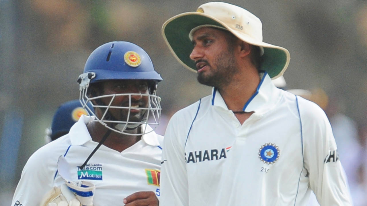 Muttiah Muralitharan chats with Harbhajan Singh after batting in the first innings, day three, first Test, Sri Lanka v India, Galle, July 20, 2010.