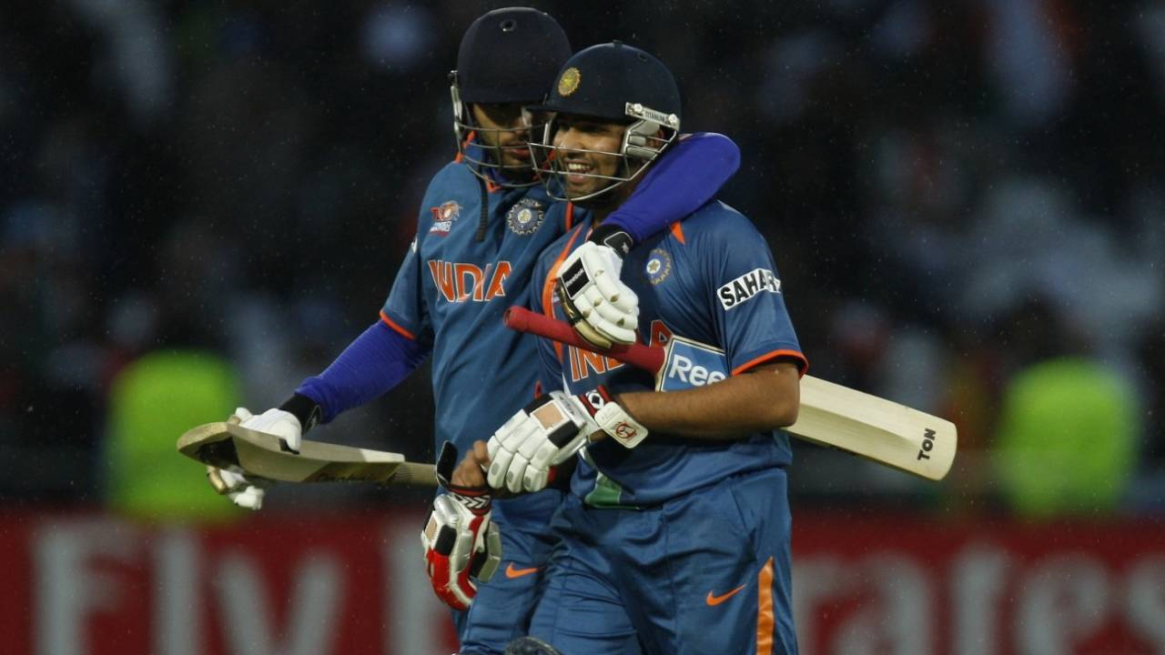 Yuvraj Singh and Rohit Sharma walk back after India's win