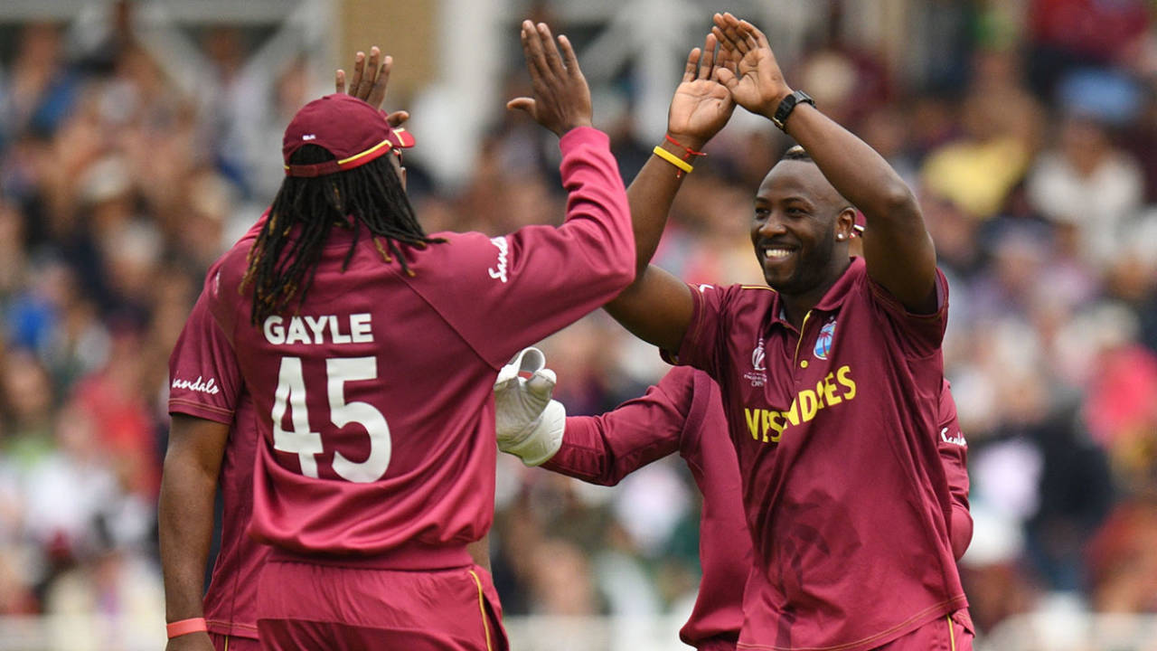 Andre Russell celebrates a wicket with Chris Gayle at the 2019 World Cup
