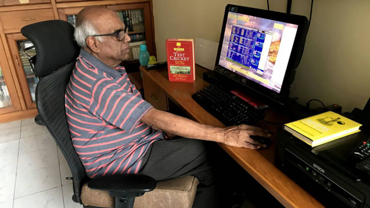 Cricket analyst Anantha Narayanan works on his computer