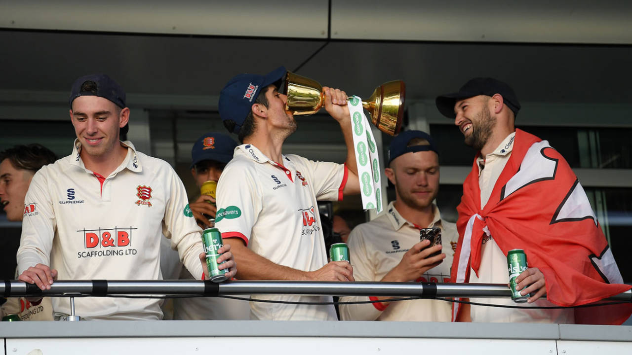 Alastair Cook drinks from the County Championship trophy on the Essex balcony, Somerset v Essex, Taunton, September 26, 2019
