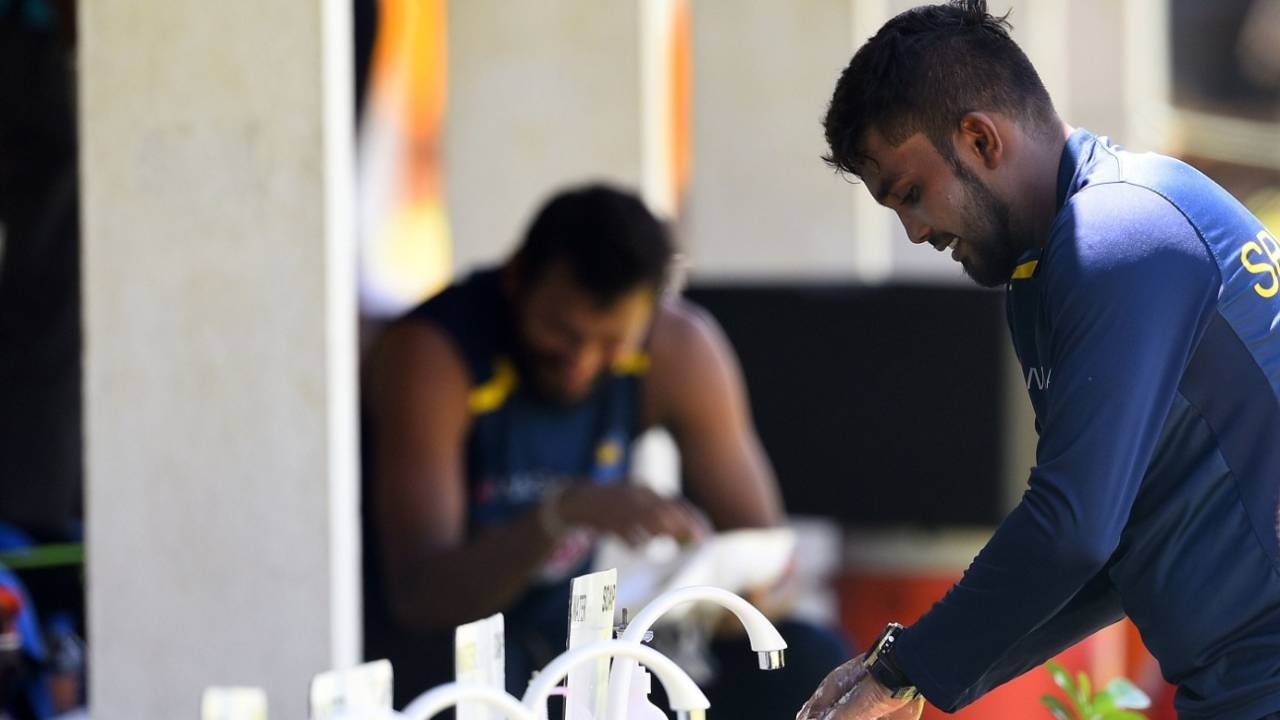 Wanindu Hasaranga washes his hands after a practice session at the Colombo Colts Cricket Stadium&nbsp;&nbsp;&bull;&nbsp;&nbsp;AFP / Getty Images
