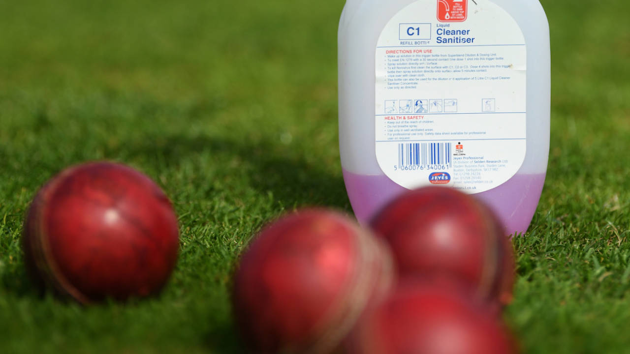 A cleaning sanitiser bottle lies next to some some balls in the outfield during a net session,  County Ground, Taunton, June 15, 2020