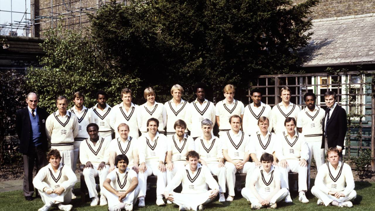 The Middlesex squad for the 1982 squad. Back row (left to right): Harry Sharp (scorer), Don Bennett, Colin Cook, Wilf Slack, Nick Kemp, Bill Merry, Andy Smith, Norman Cowans, Kevan James, Neil Williams, Paul Downton, Roland Butcher, John Miller. Middle row: Wayne Daniel, Graham Barlow, Mike Selvey, Mike Gatting, Mike Brearley (capt), Phil Edmonds, Clive Radley and John Emburey. Front row: George Ritchie, Rajesh Maru, Simon Hughes, Colin Metson, Keith Tomlins, April 20, 1982