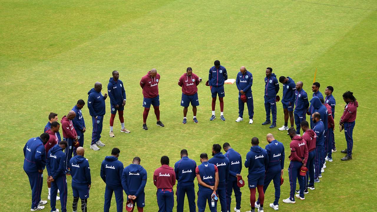 The West Indies team observes a minute's silence in memory of Sir Everton Weekes 