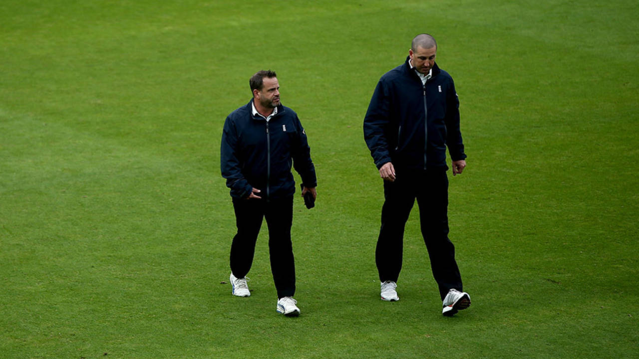 Umpires Paul Baldwin and Michael Gough inspect the field, County Championship Division One, Surrey v Middlesex, day three, The Oval, August 30, 2017