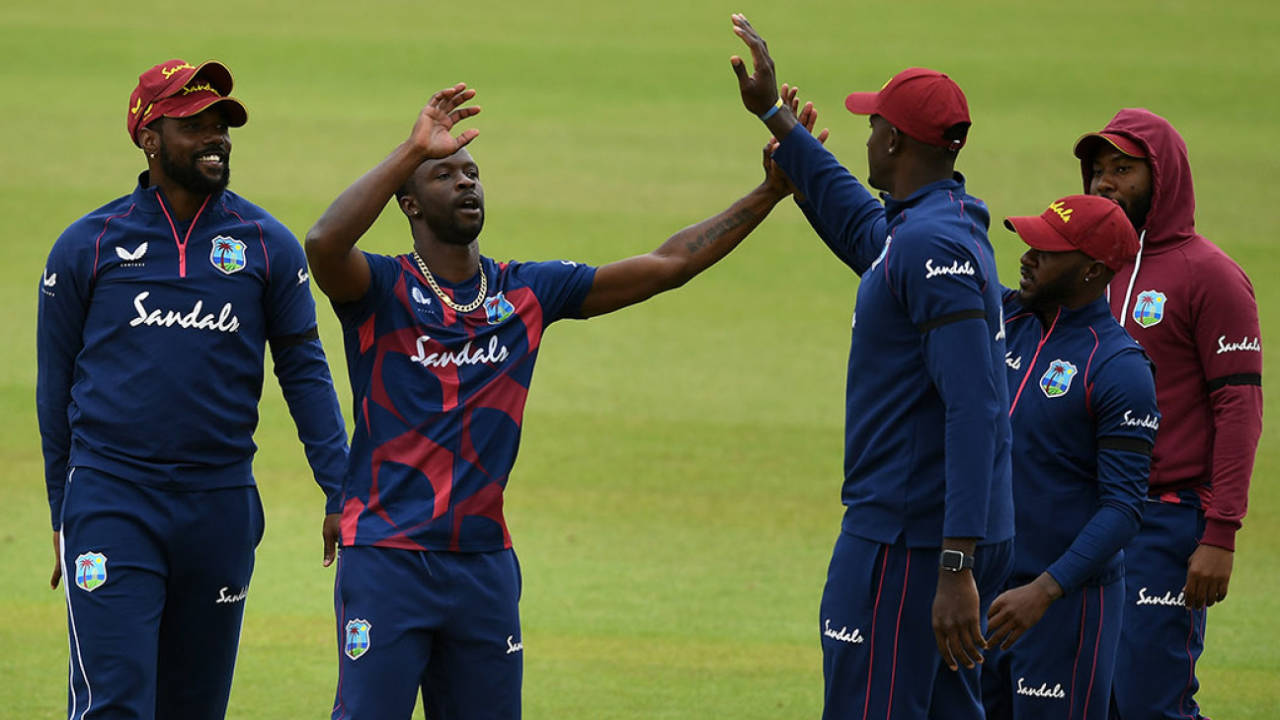 Kemar Roach celebrates with Jason Holder during Day Four of West Indies' final warm-up, intra-squad match, Old Trafford, July 02, 2020