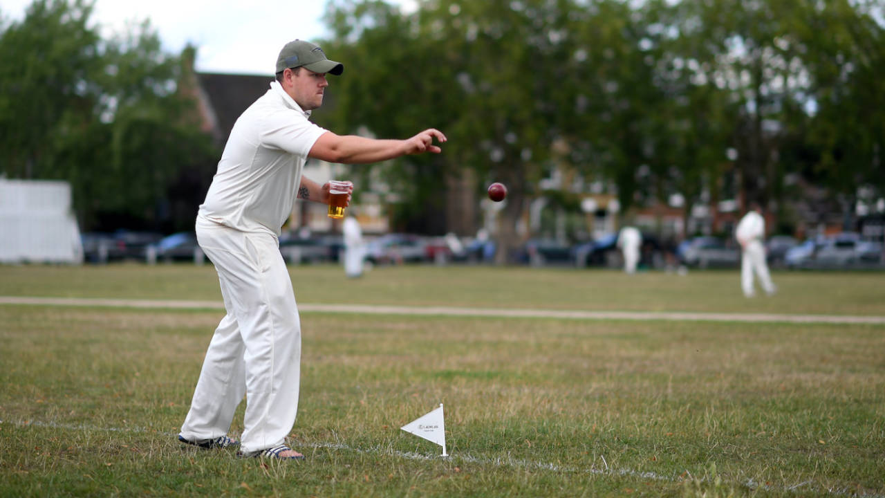 A member of the Kew Cricket Club fields on the boundary, London, July 11, 2020 
