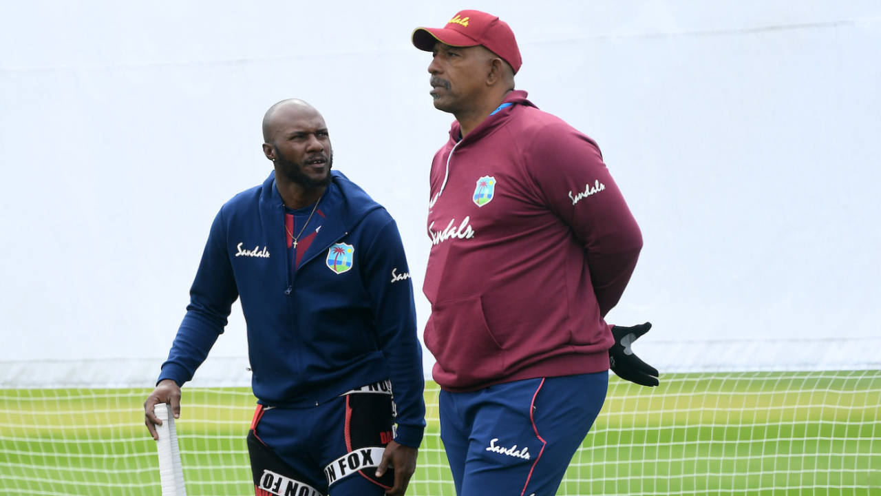 Jermaine Blackwood and Phil Simmons have a chat on the sidelines, Old Trafford, July 14, 2020