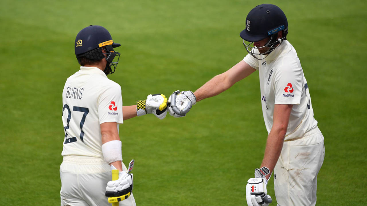Dom Sibley and Rory Burns punch gloves, England v West Indies, 3rd Test, Emirates Old Trafford, 3rd day, July 26, 2020
