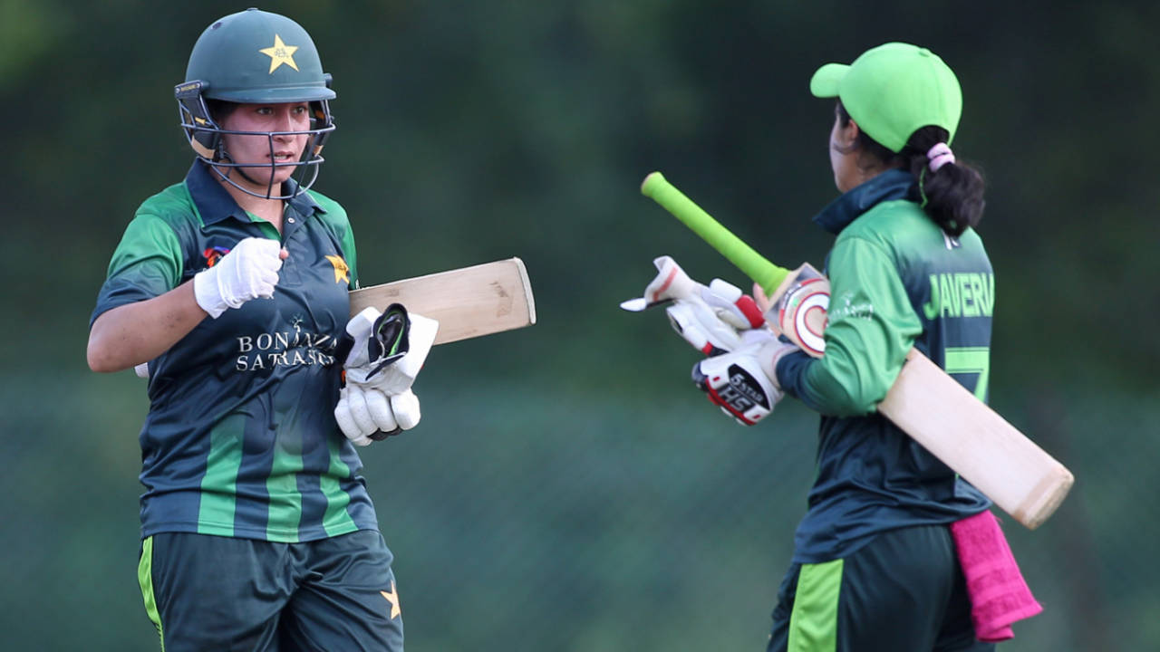Nahida Khan and Javeria Khan reach out for a fist pump, Pakistan v Thailand, Women's T20 Asia Cup 2018, Kuala Lumpur