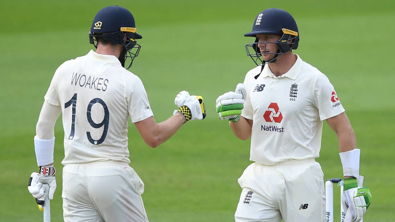 Jos Buttler and Chris Woakes punch gloves, England v Pakistan, 1st Test, Old Trafford, 4th day, August 8, 2020