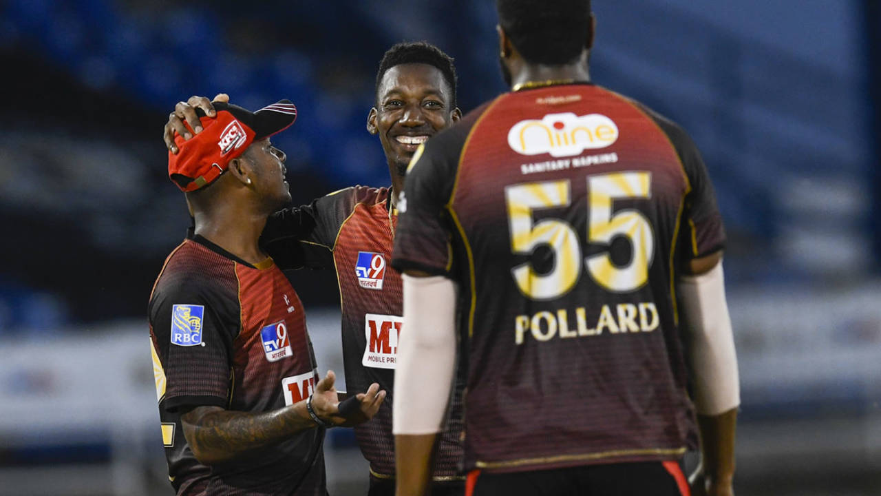 Khary Pierre celebrates a breakthrough with Tion Webster and Kieron Pollard, Trinbago Knight Riders v Guyana Amazon Warriors, Port-of-Spain, CPL, August 27, 2020