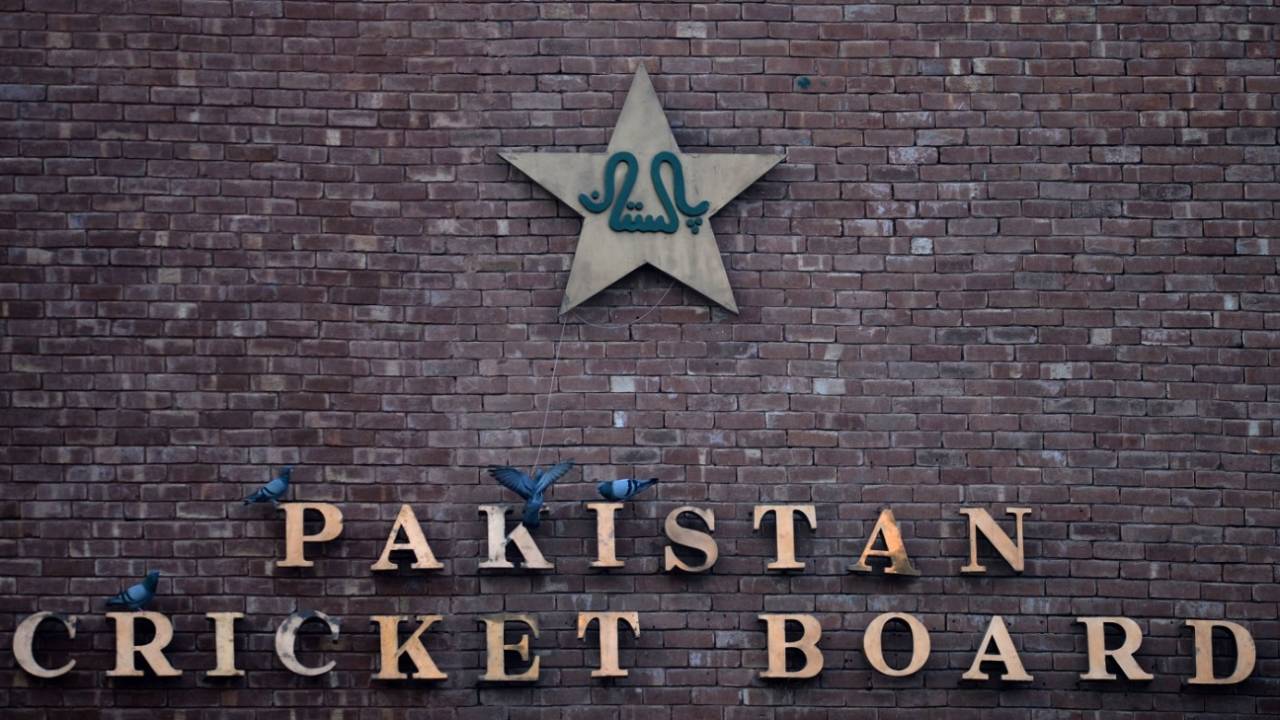 Pigeons resting on a sign of the Pakistan Cricket Board at the Gaddafi Stadium in Lahore, September 7, 2017
