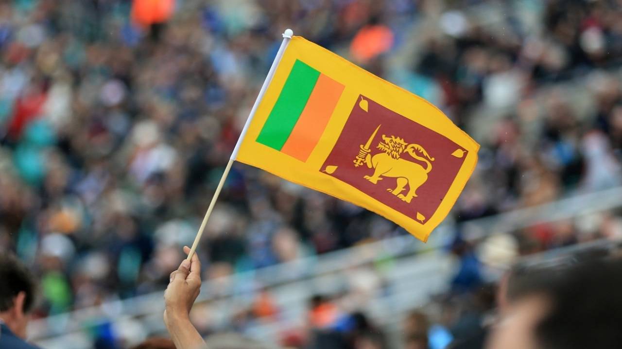 A fan holds up a Sri Lanka flag&nbsp;&nbsp;&bull;&nbsp;&nbsp;Getty Images
