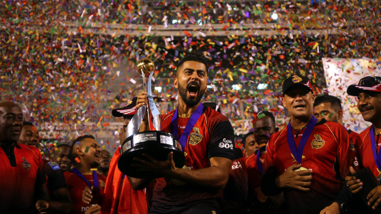 Ali Khan celebrates with the winners trophy after the CPL final, Trinbago Knight Riders v Guyana Amazon Warriors, Brian Lara Stadium, Tarouba, Trinidad and Tobago, September 16, 2018