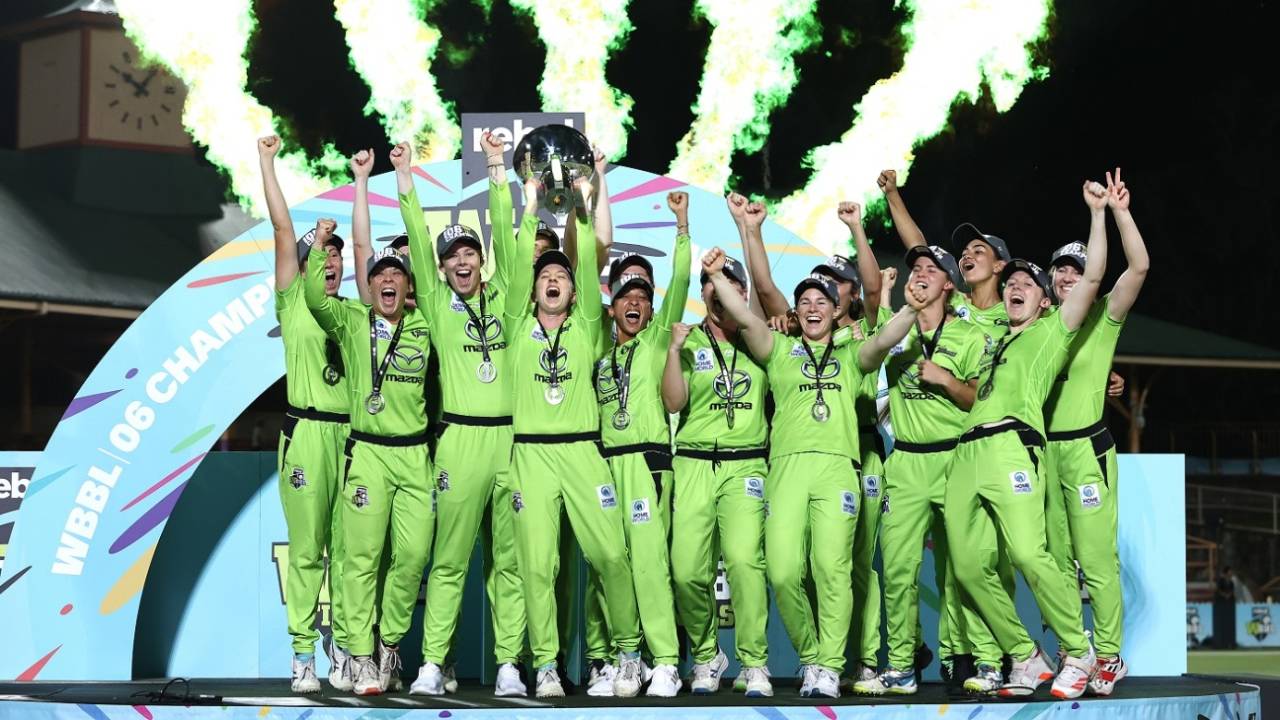 The Sydney Thunder players celebrate with the trophy&nbsp;&nbsp;&bull;&nbsp;&nbsp;Getty Images
