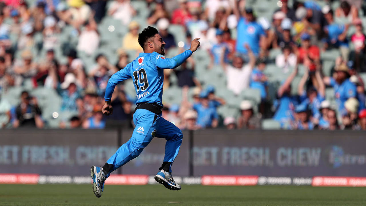 Rashid Khan races off after claiming his hat-trick&nbsp;&nbsp;&bull;&nbsp;&nbsp;Getty Images