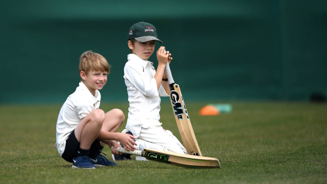 Young cricketers look on during a junior training session at The Wimbledon Cricket Club,  London, England, June 28, 2020