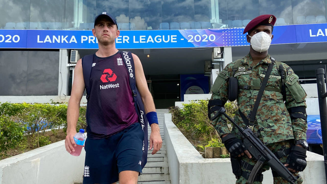 Olly Stone walks past a guard during England's training session, Hambantota, January 6, 2021