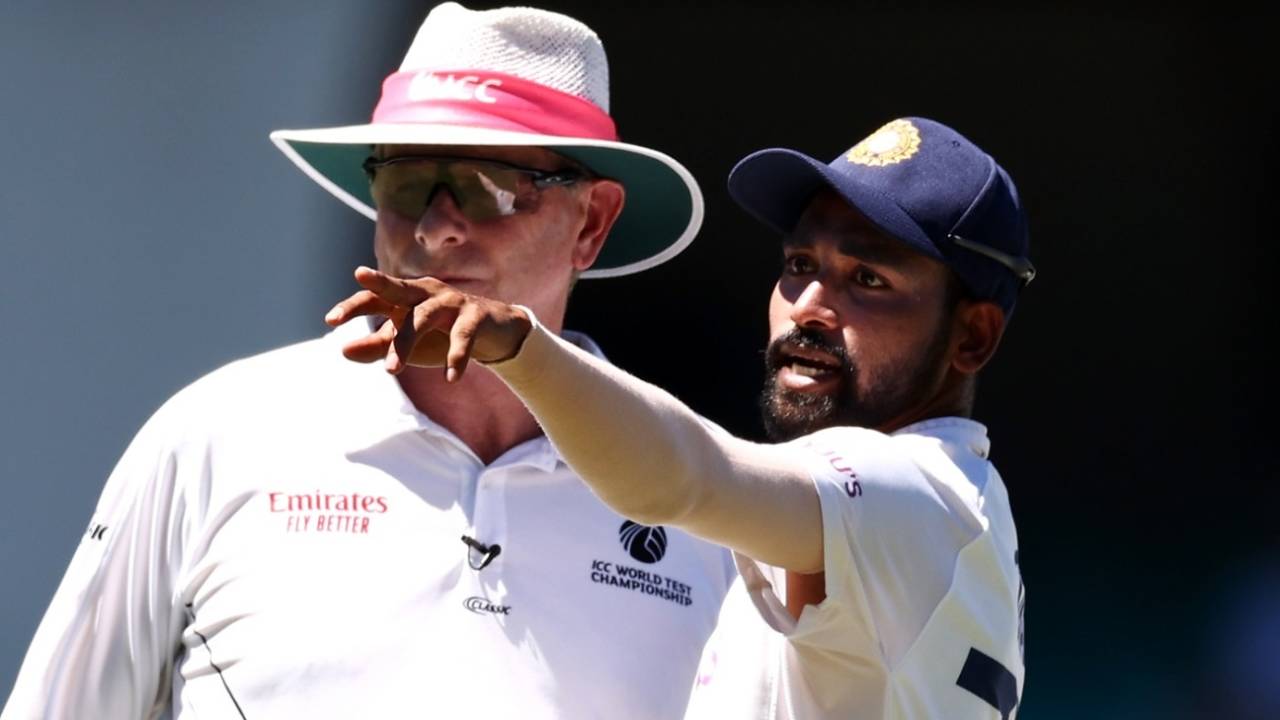 Mohammed Siraj points to a section of the stands alongside umpire Paul Reiffel&nbsp;&nbsp;&bull;&nbsp;&nbsp;Getty Images