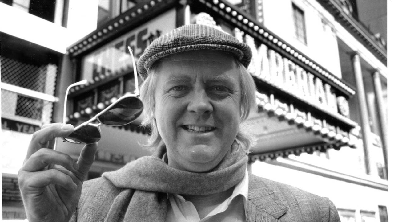 Tim Rice, lyricist for the musical Chess, poses in front of the show marquee at the Imperial Theatre, New York City, April 5, 1988