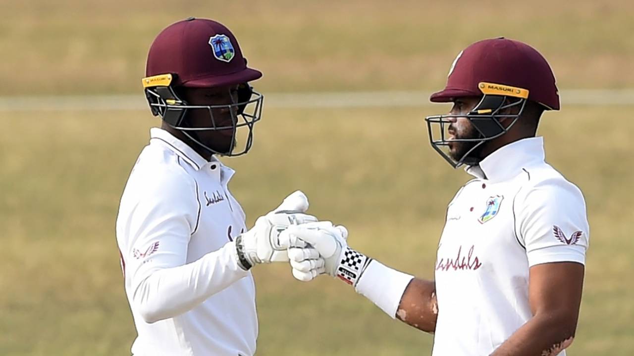 Nkrumah Bonner and John Campbell bump fists during their 129-run stand, BCB XI vs West Indians, Tour match, 2nd day, Chattogram, January 30, 2021