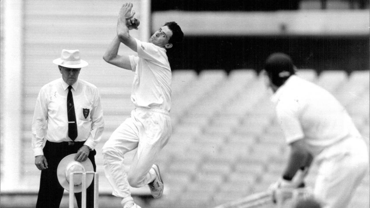 Queensland bowler Greg Rowell in action, January 13, 1992