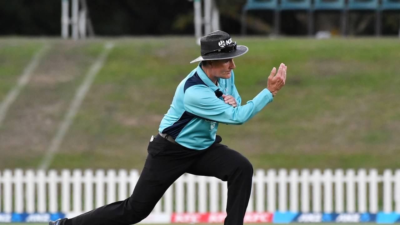 Umpire Billy Bowden signals a four in his characteristic style