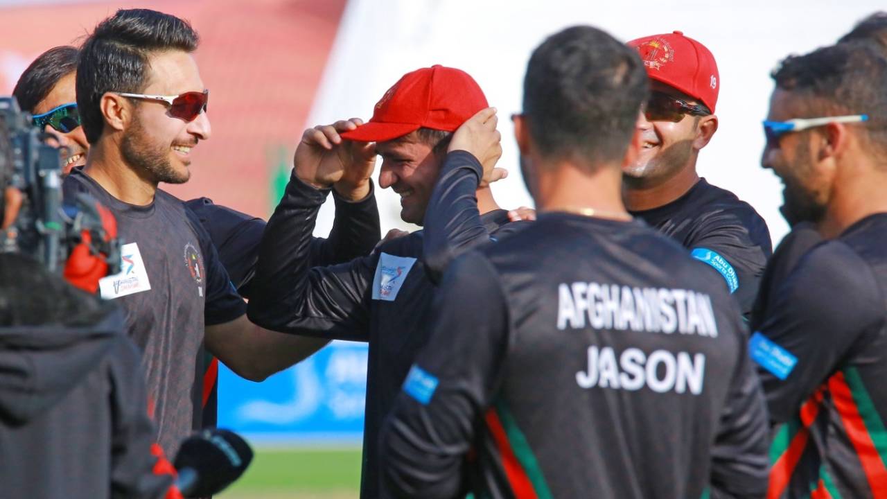 Rahmat hands over the cap to debutant Munir Ahmad, Afghanistan vs Zimbabwe, 1st Test, Abu Dhabi, 1st day, March 2, 2021