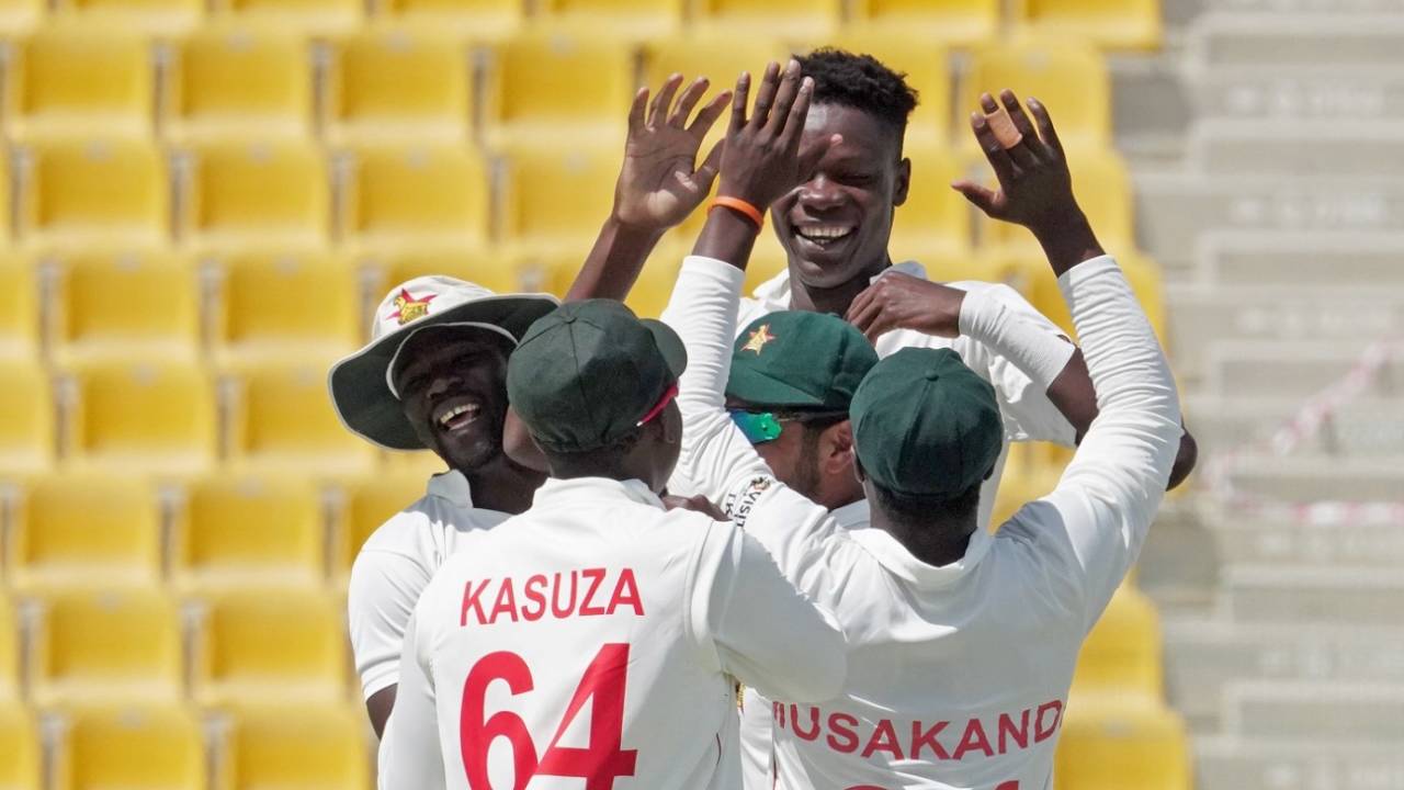 Blessing Muzarabani celebrates a wicket with his team-mates, Afghanistan vs Zimbabwe, 1st Test, Abu Dhabi, 2nd day, March 3, 2021