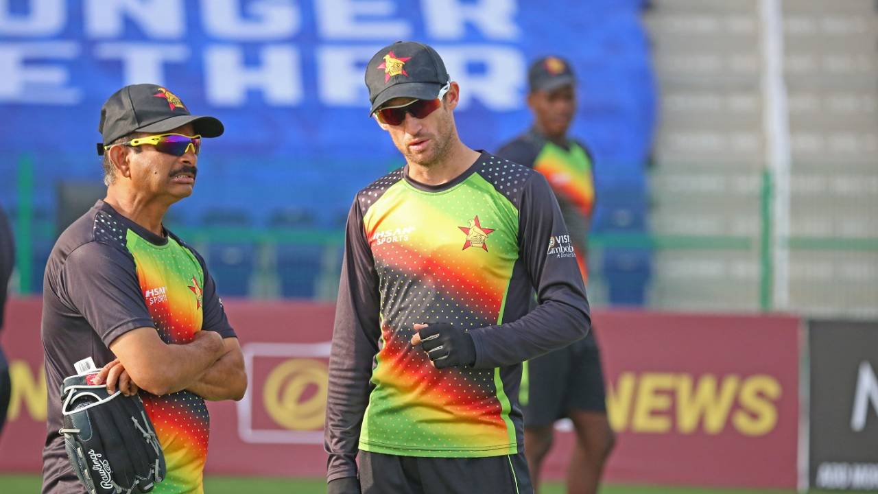 Captain Sean Williams and coach Lalchand Rajput have a chat, Afghanistan v Zimbabwe, 2nd Test, 2nd day, Abu Dhabi, March 11, 2021