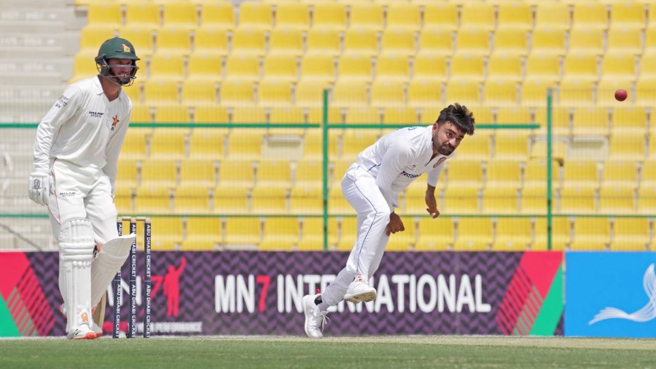 Rashid Khan bowls as Sean Williams looks on, Afghanistan vs Zimbabwe, 2nd Test, Abu Dhabi, 3rd day, March 12, 2021