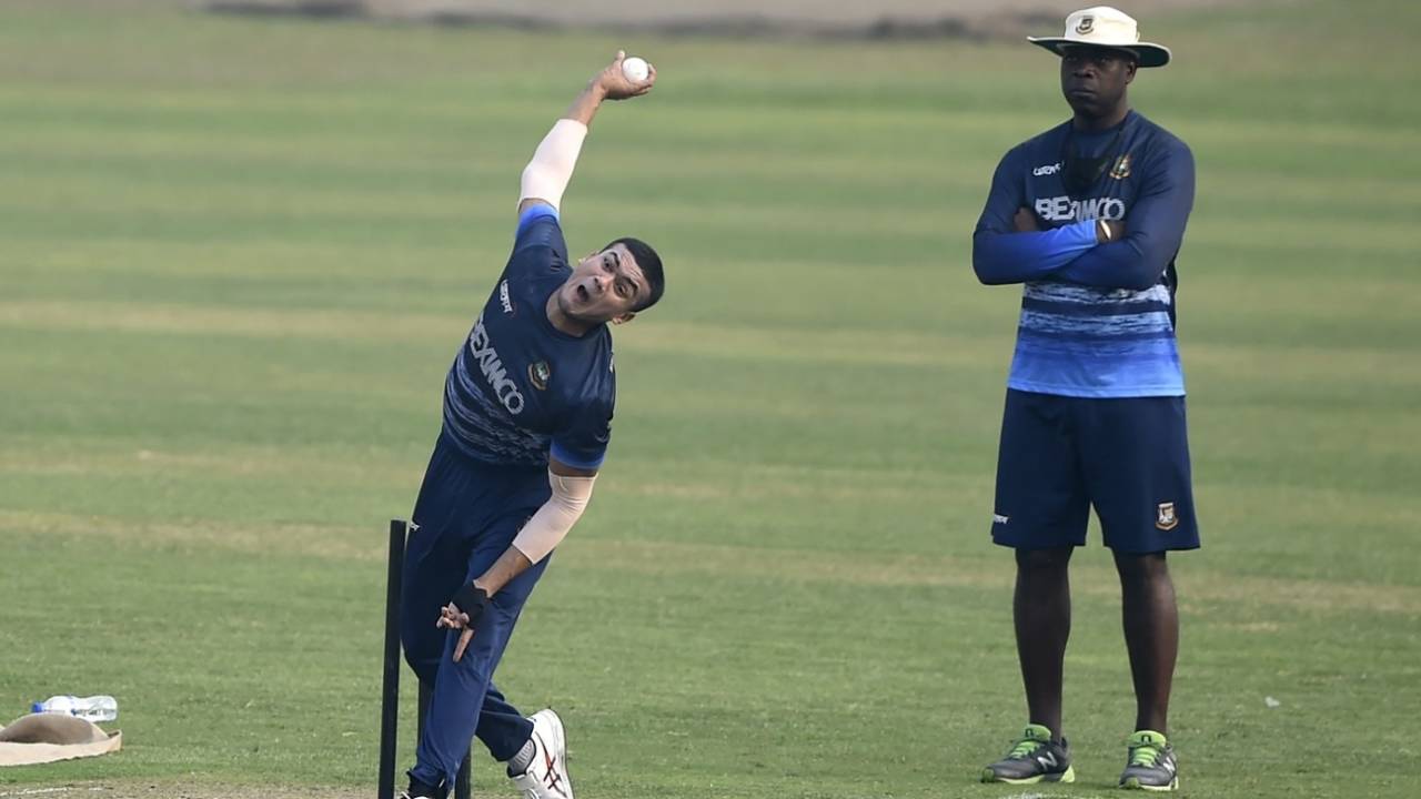 Taskin Ahmed bowls during a practice session as Ottis Gibson looks on, Dhaka, January 18, 2021