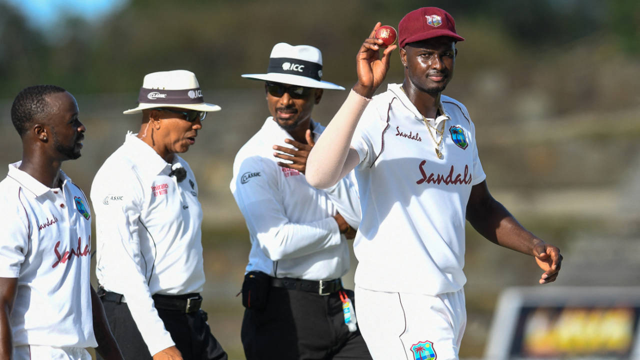 Jason Holder holds the ball aloft after completing his eighth five-wicket haul in Tests, West Indies vs Sri Lanka, 1st Test, North Sound, 1st day, March 21, 2021