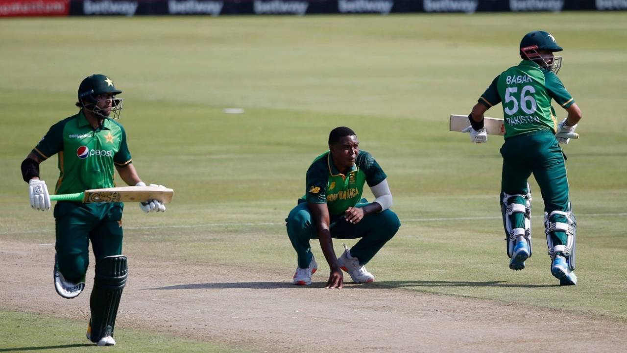 Imam-ul-Haq and Babar Azam run between the wickets as Lungi Ngidi, down on his haunches, looks on, South Africa vs Pakistan, 1st ODI, Centurion, April 2, 2021