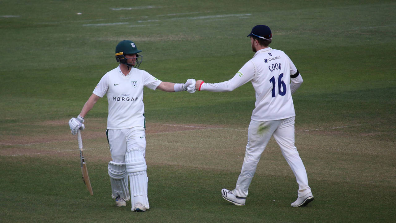 Jake Libby and Sam Cook punch gloves at the end of Worcestershire's innings, Essex v Worcestershire, Chelmsford, 4th day, April 11, 2021