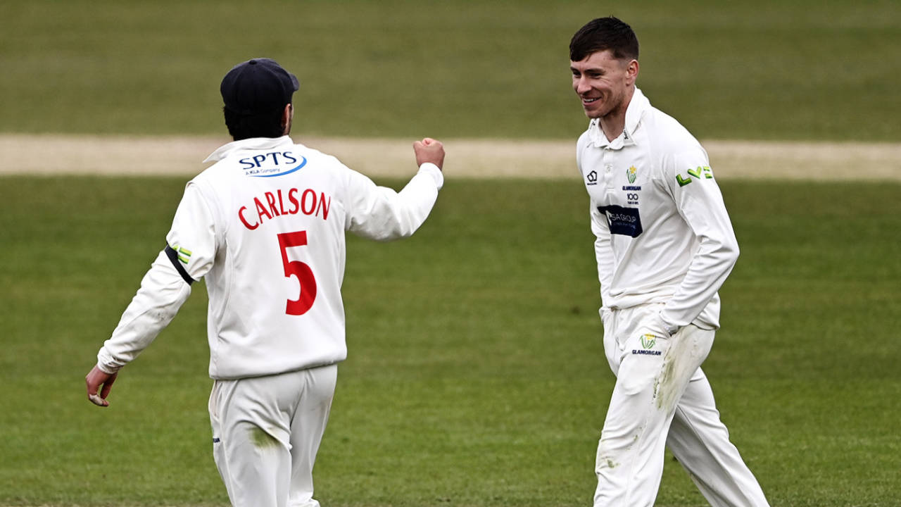 Callum Taylor keeps his hands in his pockets while celebrating a wicket with fielder Kiran Carlson, Yorkshire vs Glamorgan, County Championship, Headingley, April 9, 2021