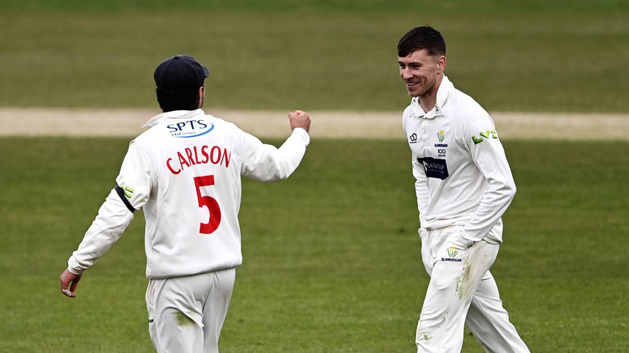 Callum Taylor keeps his hands in his pockets while celebrating a wicket with fielder Kiran Carlson, Yorkshire vs Glamorgan, County Championship, Headingley, April 9, 2021
